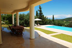 Table on veranda overlooks pool